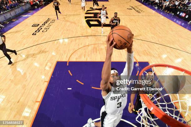 Keldon Johnson of the San Antonio Spurs dunks the ball during the game against the Phoenix Suns on October 31, 2023 at Footprint Center in Phoenix,...