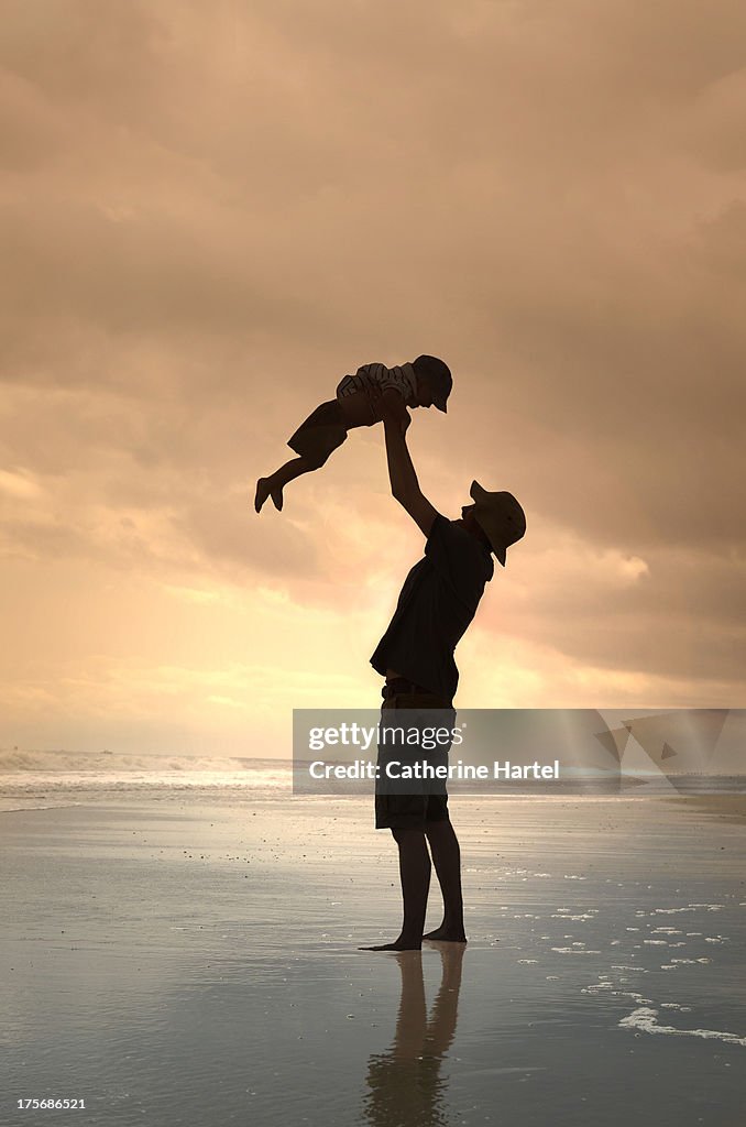 Father and Child Silhouette on the Beach