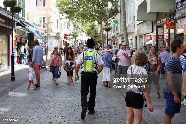 Police officer walks along Gibraltar's Main Street on August 6, 2013 in Gibraltar. Tensions between the British and Spanish governments have been...