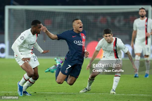 Kylian Mbappe of PSG between Pierre Kalulu and Christian Pulisic of AC Milan during the UEFA Champions League match between Paris Saint-Germain and...