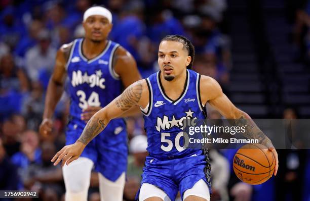 Cole Anthony of the Orlando Magic looks to pass during the opening night game against the Houston Rockets at Amway Center on October 25, 2023 in...