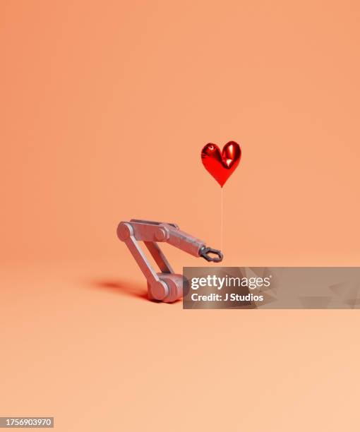 falling in love concept image - robotic heart stock-fotos und bilder