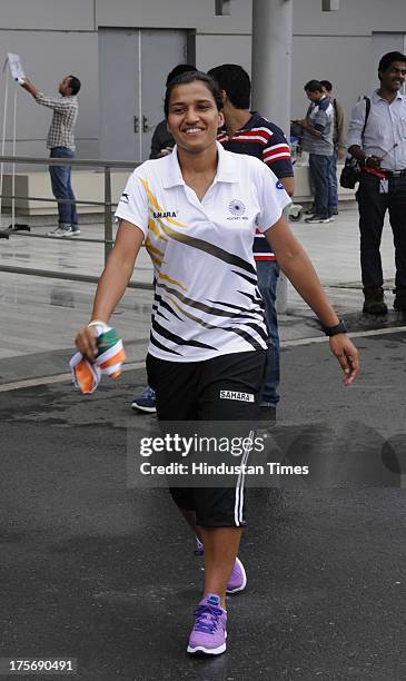 Rani Rampal, star player of Indian Women's Junior Hockey team which won bronze medal at Junior Hockey World Cup after arrival at the Indira Gandhi...