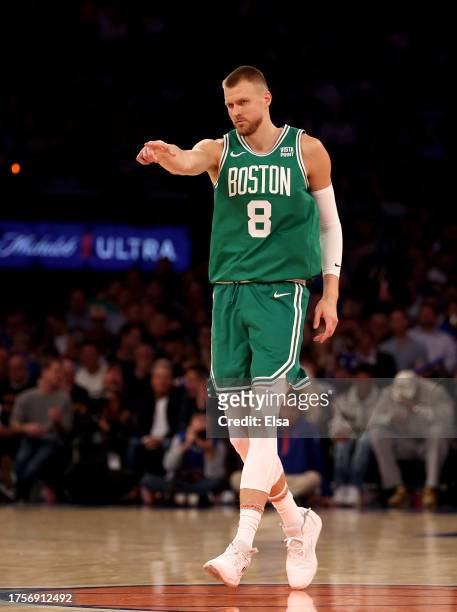 Kristaps Porzingis of the Boston Celtics celebrates an assist in the first half against the New York Knicks at Madison Square Garden on October 25,...