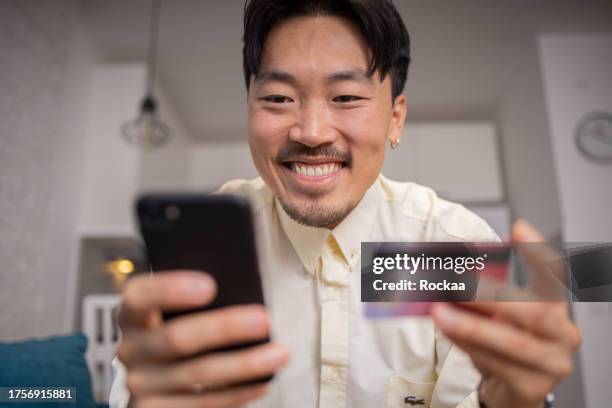 buyer enjoys the convenience of shopping online - online bank statement stock pictures, royalty-free photos & images