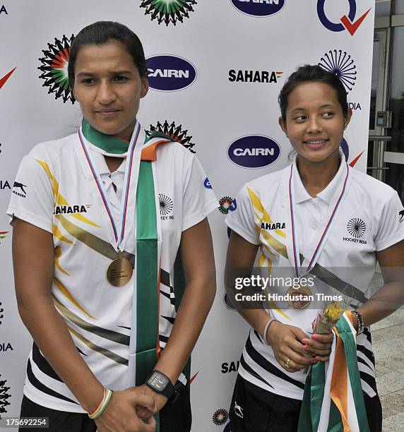 Sushila Chanu captain and Rani Rampal, player of Indian Women's Junior Hockey team which won bronze medal at Junior Hockey World Cup pose with their...