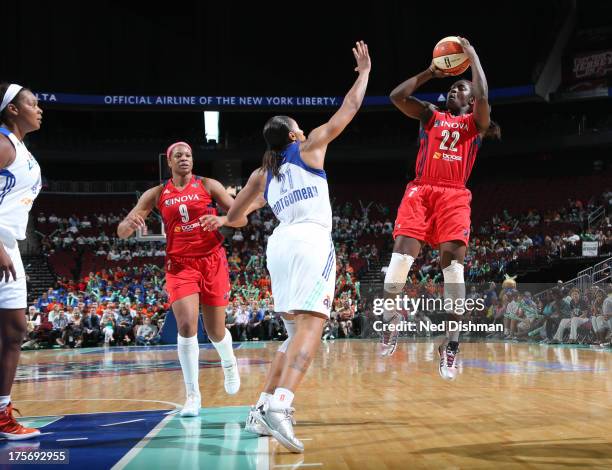 Matee Ajavon of the Washington Mystics shoots against Alex Montgomery of the New York Liberty at the Prudential Center on August 6, 2013 in Newark,...