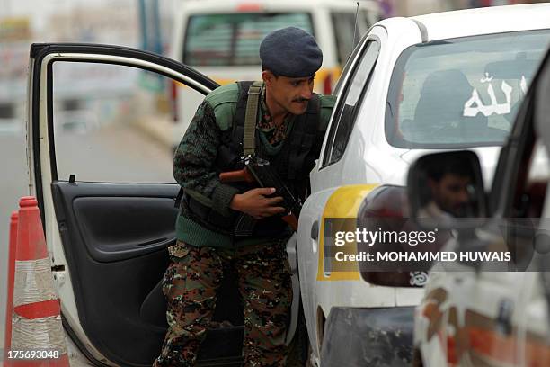 Yemeni soldier controls a vehicle near Sanaa International Airport on August 6, 2013 in Yemen. The United States ordered Americans to leave Yemen...