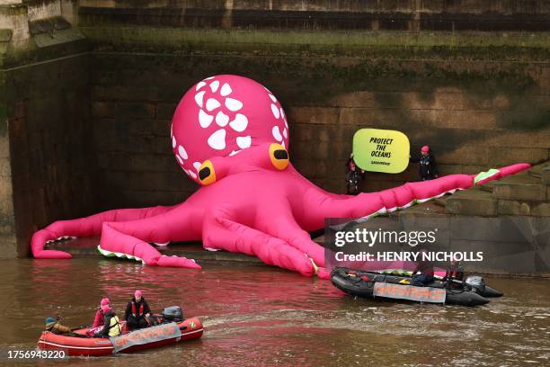 Giant inflatable Octopus is pictured on the bank of the River Thames beneath Britain's Houses of Parliament, during an action called by environmental...