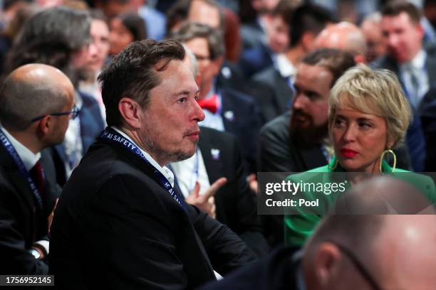 Elon Musk, CEO of Tesla and X sits with delegates at the AI Safety Summit in Bletchley Park, on November 1, 2023 in Bletchley, England. The UK...