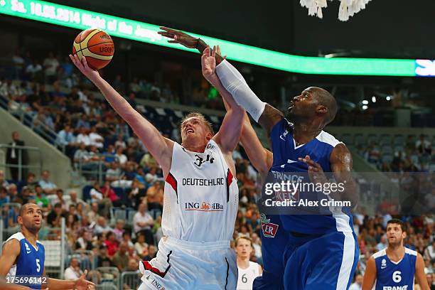 Johannes Lischka of Germany is challenged by Johan Petro of France during the international friendly match between Germany and France at SAP Arena on...