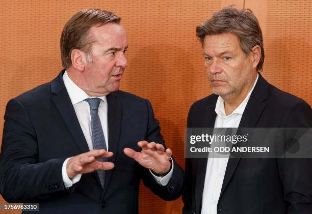 German Defence Minister Boris Pistorius talks to German Minister of Economics and Climate Protection Robert Habeck ahead the weekly cabinet meeting...