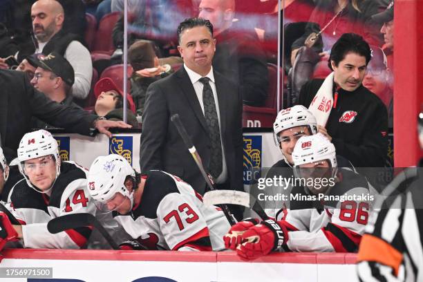 Associate coach Travis Green, of the New Jersey Devils, handles bench duties during the second period against the Montreal Canadiens at the Bell...