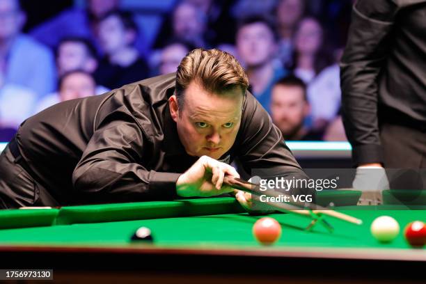 Shaun Murphy of England plays a shot in the third round match against Sean O'Sullivan of England on day four of 2023 Northern Ireland Open at...