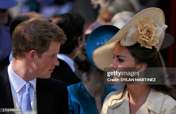 Britain's Prince Harry, talks with Catherine, Duchess of Cambridge, after they attended the wedding between England rugby player Mike Tindall and...