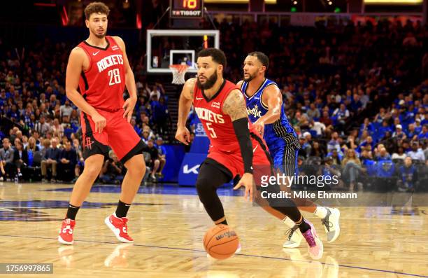 Fred VanVleet of the Houston Rockets drives to the basket during the opening night game against the Orlando Magic at Amway Center on October 25, 2023...