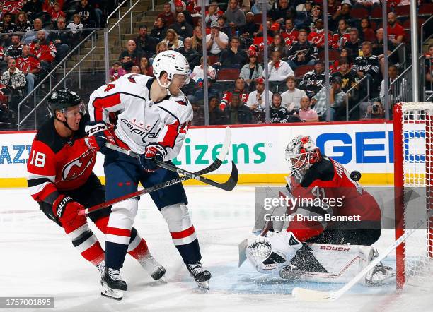 Connor McMichael of the Washington Capitals scores at 2:09 of the third period against Vitek Vanecek of the New Jersey Devils at Prudential Center on...