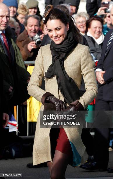 Kate Middleton, the fiancee of Britain's Prince William, smiles as she arrives to attend a naming ceremony and service of dedication for the Royal...