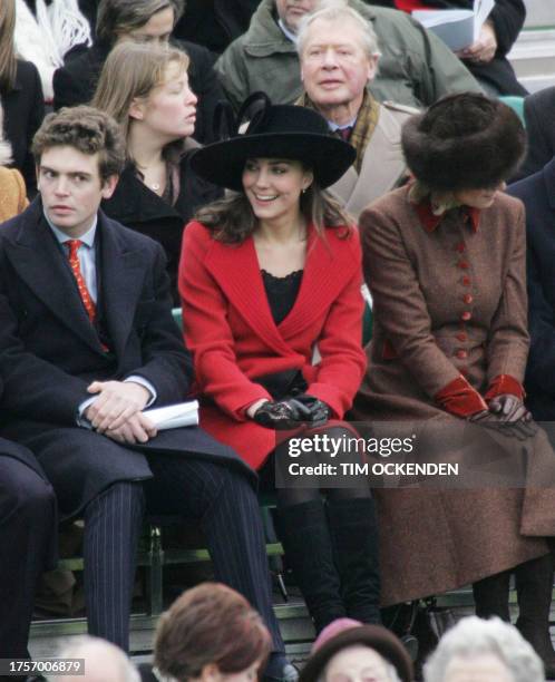 Kate Middleton, sits in the stands as her boyfriend Britain's Prince William takes part in the Sovereign's Parade at The Royal Military Academy in...