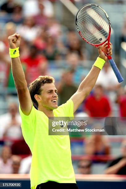 Vasek Pospisil of Canada celebrates match point against John Isner of the United States during the Rogers Cup at Uniprix Stadium on August 6, 2013 in...