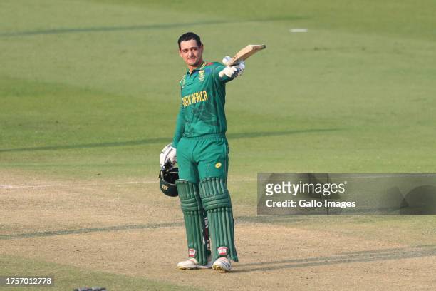Quinton de Kock of South Africa celebrates after scoring a hundred during the ICC Men's Cricket World Cup 2023 match between South Africa and New...