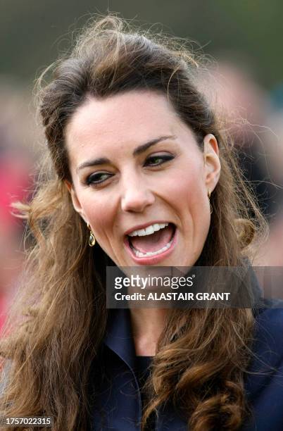 Kate Middleton, fiancee of Britain's Prince William, meets well-wishers during a visit with William to Witton County Park, in Darwen, north-west...