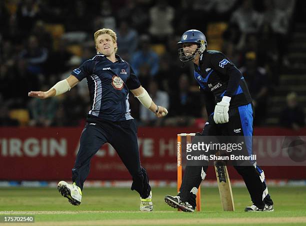 David Willey of Northamptonshire Steelbacks comes into bowl as Gordon Muchall of Durham Dynamos looks on during the Friends Life T20 Quarter Final...