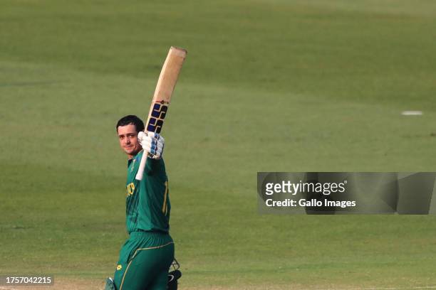 Quinton de Kock of South Africa celebrates after scoring a hundred during the ICC Men's Cricket World Cup 2023 match between South Africa and New...