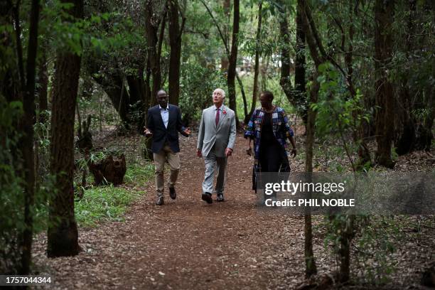 Britain's King Charles III gets a tour from the daughter of Nobel Peace Prize winner Professor Wangari Maathai, Wanjira Mathai , and professor...