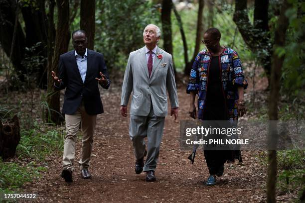 Britain's King Charles III gets a tour from the daughter of Nobel Peace Prize winner Professor Wangari Maathai, Wanjira Mathai , and professor...