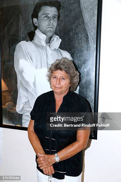 President of Ramatuelle Festival Jacqueline Franjou poses in front of a picture of actor Gerard Philipe at Magician Eric Antoine's show, "Le mix sous...