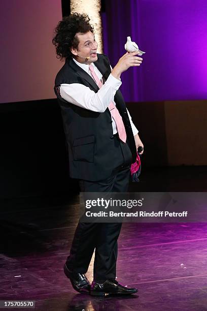 Magician Eric Antoine performs in his show "Le mix sous les etoiles" on day 7 of the 29th Ramatuelle Festival on August 6, 2013 in Ramatuelle, France.