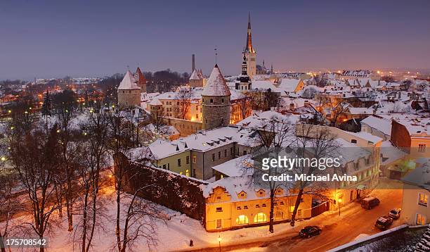 snow-covered rooftops in estonia - tallinn stock pictures, royalty-free photos & images