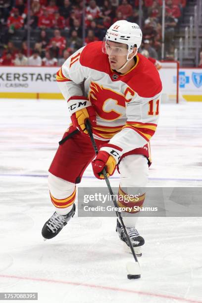 Mikael Backlund of the Calgary Flames skates against the Detroit Red Wings at Little Caesars Arena on October 22, 2023 in Detroit, Michigan.