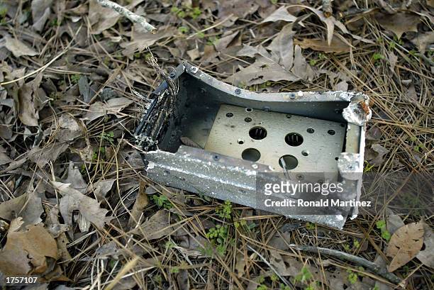 Piece of Space Shuttle Columbia debris sits on the ground February 1, 2003 in Douglass, Texas. The seven members of the Columbia crew were killed...