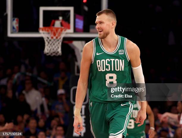 Kristaps Porzingis of the Boston Celtics celebrates his three point shot in the fourth quarter against the New York Knicks at Madison Square Garden...