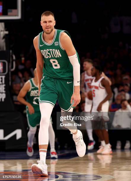 Kristaps Porzingis of the Boston Celtics celebrates his three point shot in the fourth quarter against the New York Knicks at Madison Square Garden...