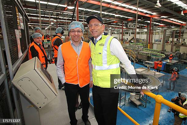 Opposition Leader Tony Abbott is given a tour of the Bickfords facility in Salisbury South by Managing Director Angelo Kotses on August 7, 2013 in...