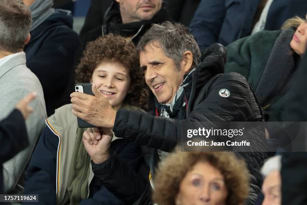 Julien Clerc attends the UEFA Champions League match between Paris Saint-Germain and AC Milan at Parc des Princes stadium on October 25, 2023 in...