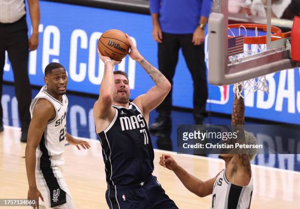 Luka Doncic of the Dallas Mavericks drives to the basket during the second quarter against the San Antonio Spurs at Frost Bank Center on October 25,...