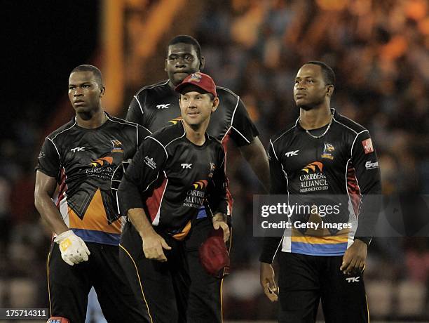 Johnson Charles , Rahkeem Cornwall , Ricky Ponting and Marlon Samuels of Antigua Hawksbills in celebration mode during the Eighth Match of the...