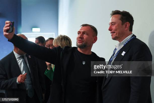 Ukraine's Deputy Minister for Digital Transformation Georgii Dubynskyi poses for a selfie with SpaceX, X , and Tesla CEO Elon Musk during the UK...
