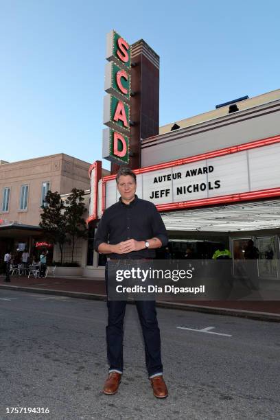 Jeff Nichols poses in front of the marquee ahead of the gala screening of "The Bikeriders"and the Auteur Award Presentation to Jeff Nichols during...