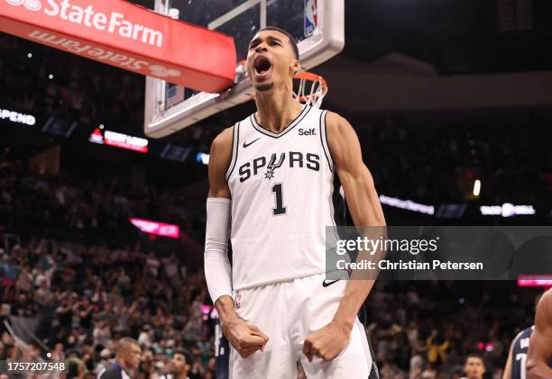 Victor Wembanyama of the San Antonio Spurs reacts after a dunk during the fourth quarter against the Dallas Mavericks at Frost Bank Center on October...