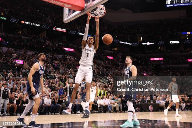 Victor Wembanyama of the San Antonio Spurs dunks during the fourth quarter against the Dallas Mavericks at Frost Bank Center on October 25, 2023 in...