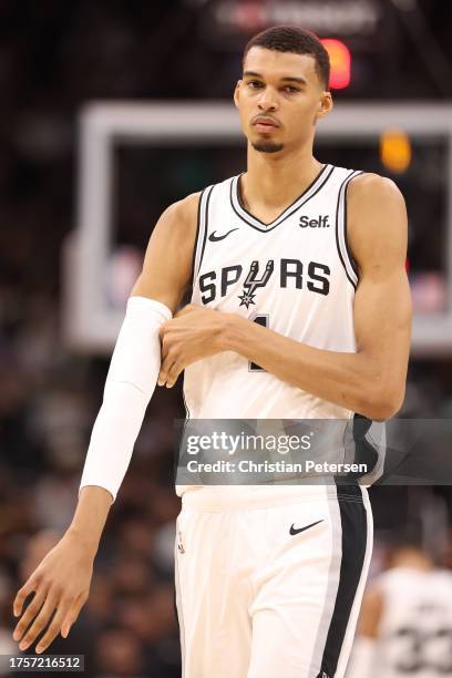 Victor Wembanyama of the San Antonio Spurs looks on during the fourth quarter against the Dallas Mavericks at Frost Bank Center on October 25, 2023...