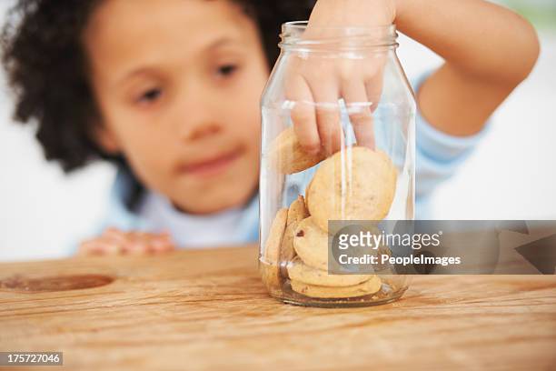 mmm, so many cookies just for me - child cookie jar stockfoto's en -beelden