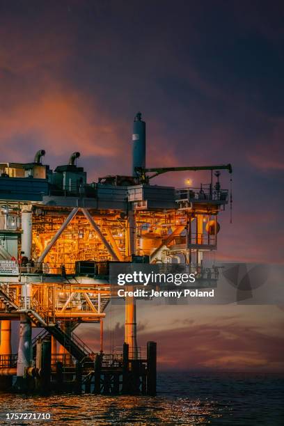offshore oil drilling rig at dusk near huntington beach - oljeplattform bildbanksfoton och bilder