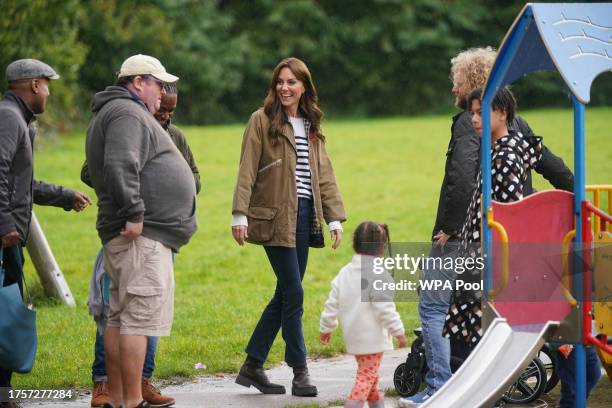Catherine, Princess of Wales takes part in a Dad Walk in the local park during a visit to "Dadvengers", a community for dads and their children, in...