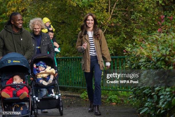 Catherine, Princess of Wales takes part in a Dad Walk in the local park during a visit to "Dadvengers", a community for dads and their children, in...